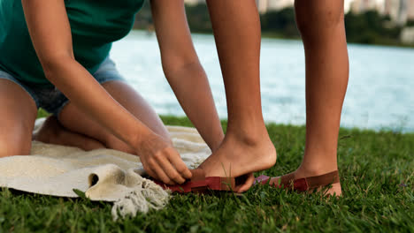 Girl-putting-shoes-on